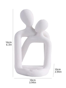 Escultura pareja abrazada porta celular
