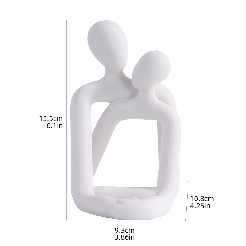 Escultura pareja abrazada porta celular